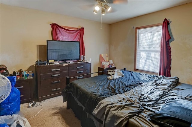 bedroom featuring ceiling fan and light colored carpet