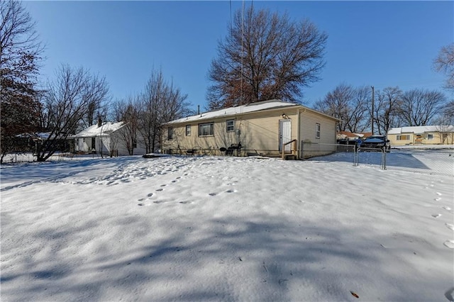 view of snow covered house