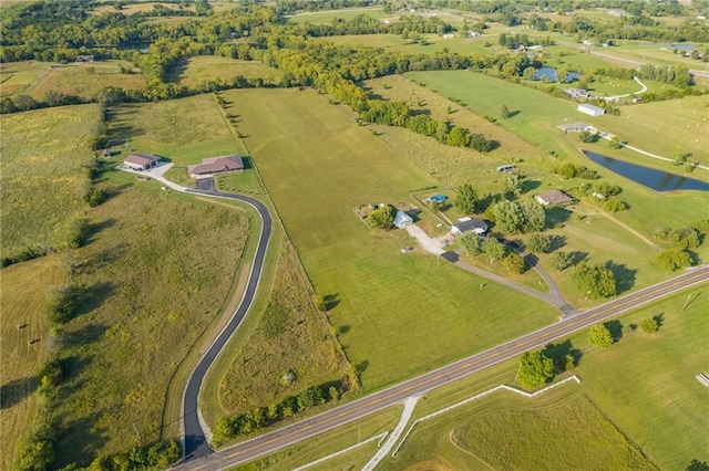 drone / aerial view featuring a rural view and a water view