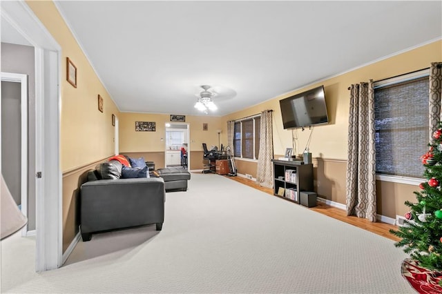 living room featuring ceiling fan and carpet floors