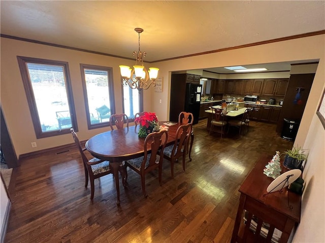 dining space with a notable chandelier, crown molding, visible vents, baseboards, and dark wood finished floors