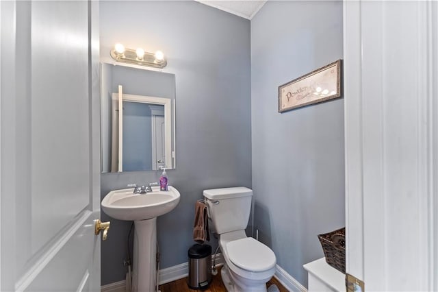 bathroom featuring toilet and sink