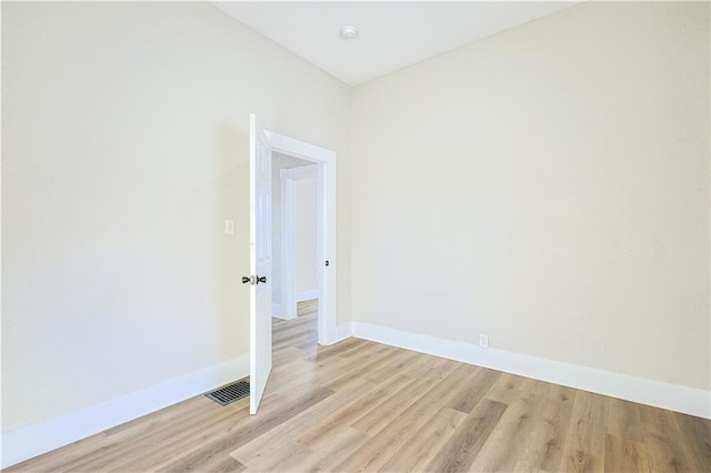 unfurnished room with light hardwood / wood-style floors