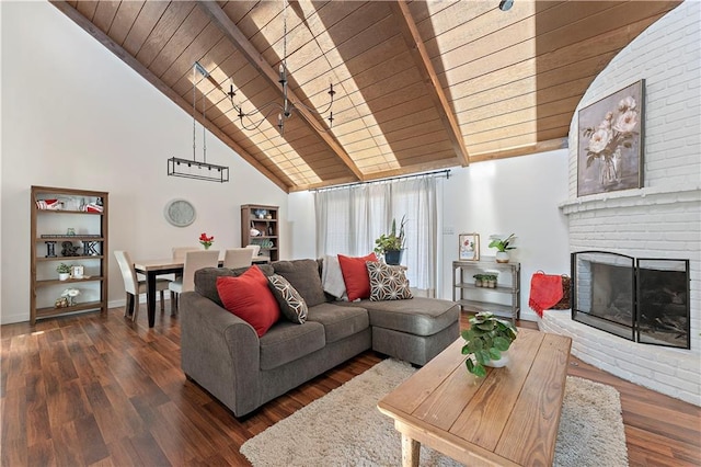 living room with wooden ceiling, dark hardwood / wood-style flooring, a fireplace, high vaulted ceiling, and beamed ceiling