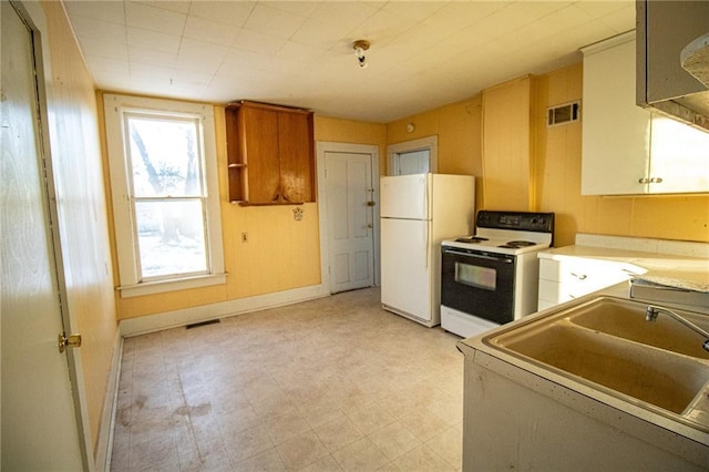 kitchen with sink and white appliances