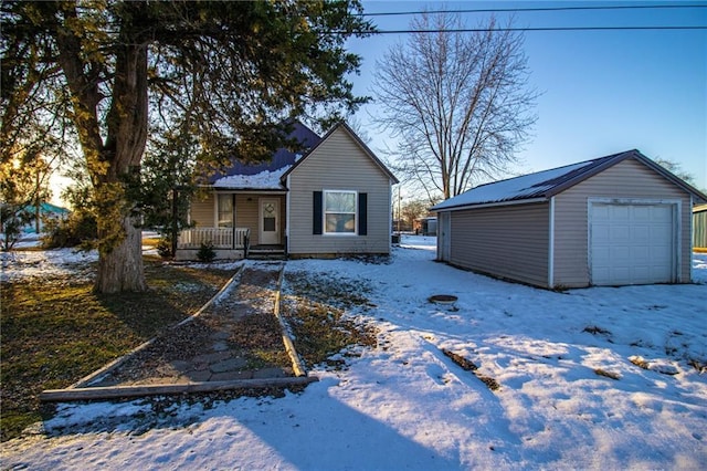 view of front of property with an outdoor structure, a porch, and a garage