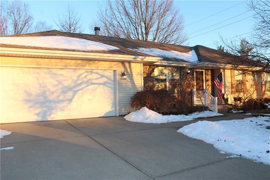 single story home featuring a garage