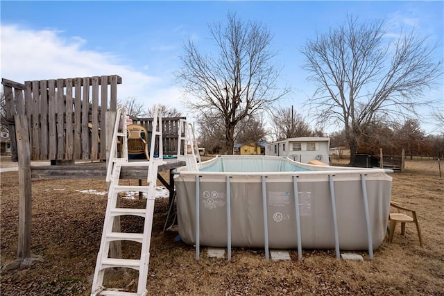 view of pool featuring a playground