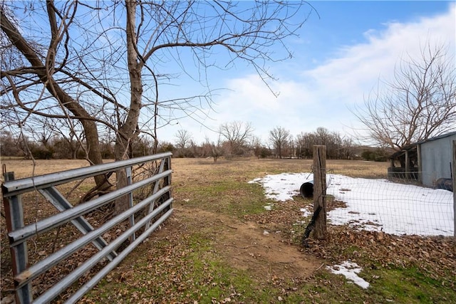 view of yard with a rural view