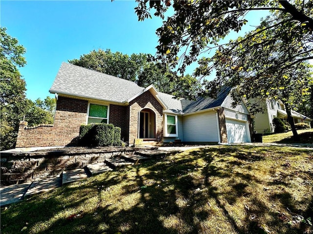 view of front facade with a front yard and a garage