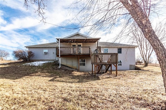 back of property featuring a yard and a deck