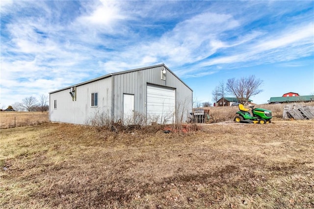 view of outbuilding featuring a garage