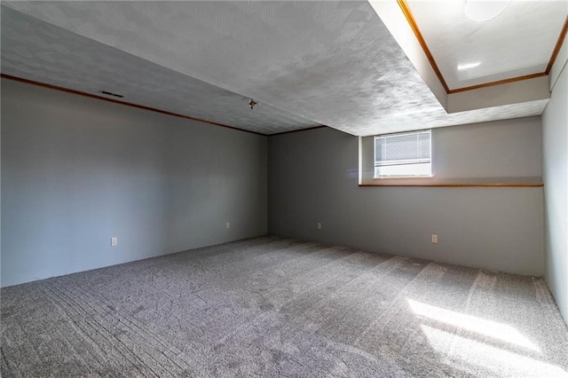 interior space with a textured ceiling and carpet flooring