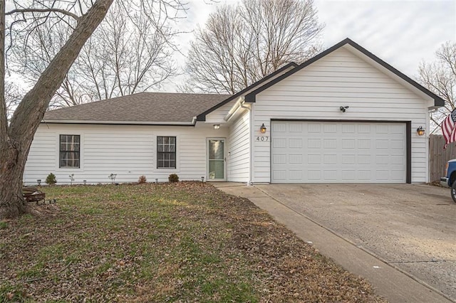 ranch-style home featuring a garage