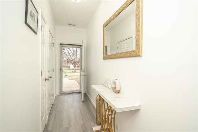 doorway to outside featuring light hardwood / wood-style flooring