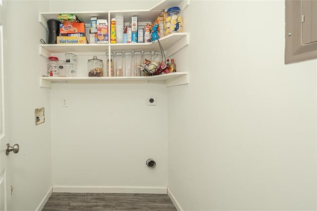 clothes washing area with dark wood-type flooring, washer hookup, electric dryer hookup, and electric panel