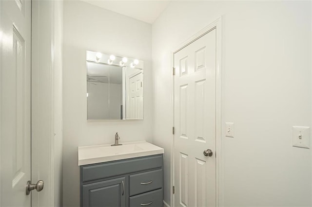 bathroom featuring ceiling fan and vanity