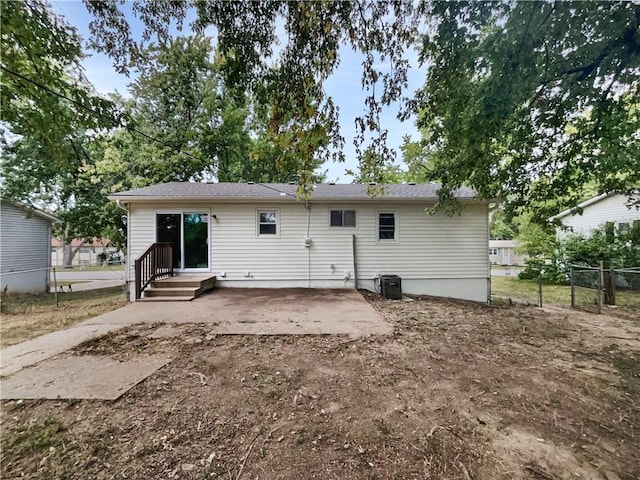 back of house featuring a patio area and central air condition unit