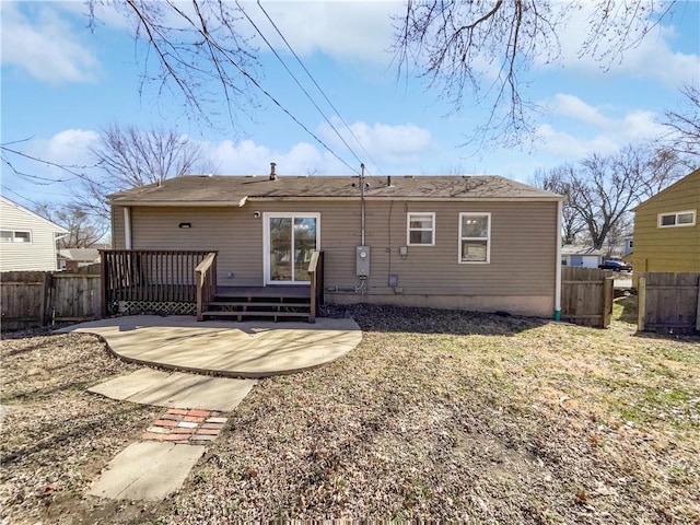 rear view of house with a patio area and a deck