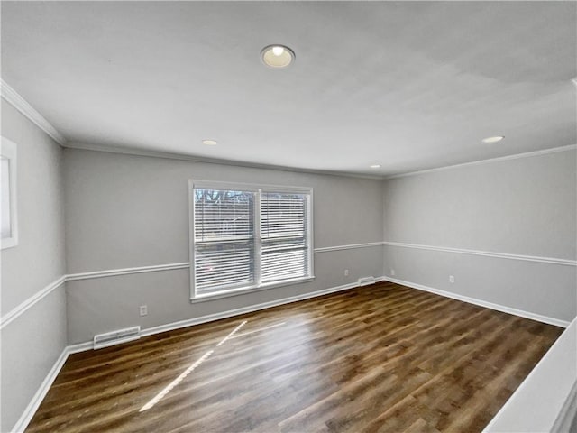 unfurnished room with dark wood-type flooring and ornamental molding