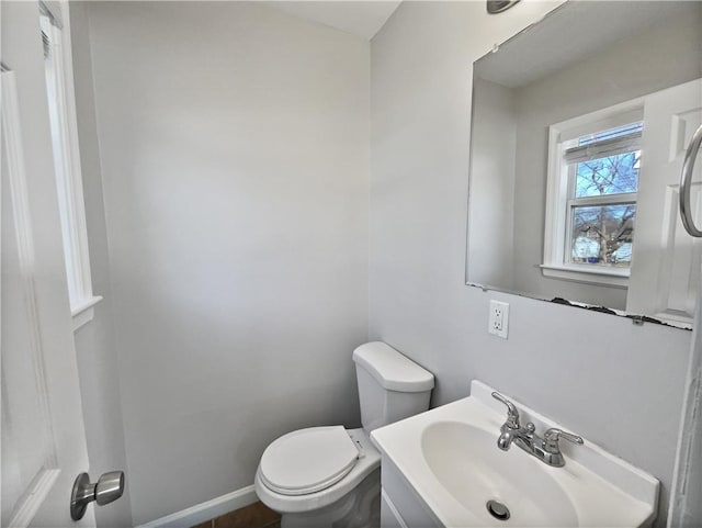 bathroom featuring toilet and vanity