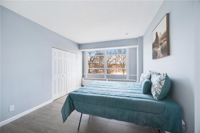 bedroom featuring hardwood / wood-style flooring and a closet