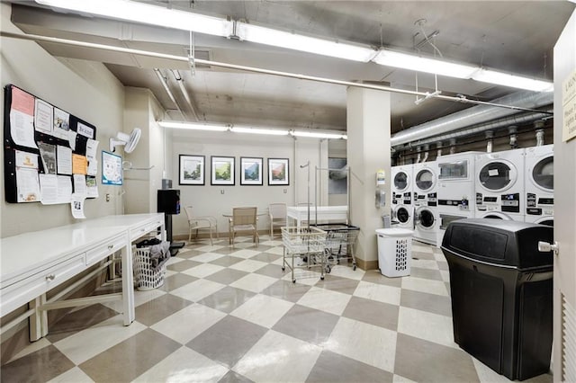 laundry room with stacked washer / drying machine