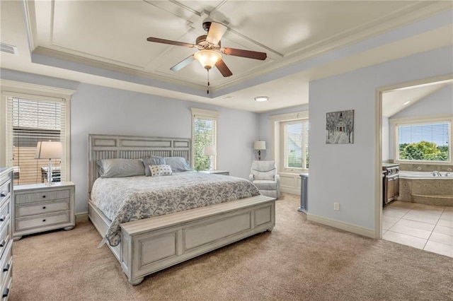 bedroom with baseboards, ornamental molding, a raised ceiling, and light colored carpet