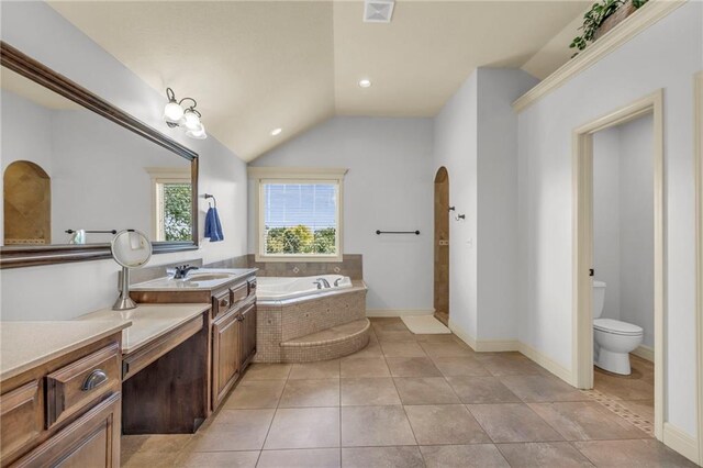 bathroom featuring visible vents, lofted ceiling, toilet, tile patterned floors, and a bath