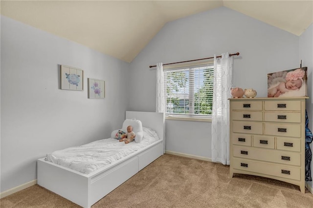 bedroom featuring lofted ceiling, carpet, and baseboards