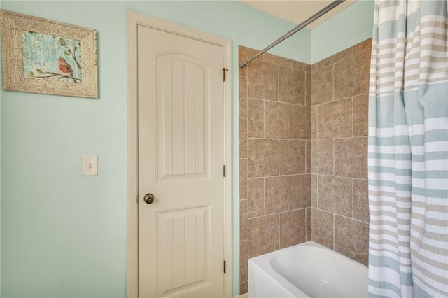 bathroom with shower / bathtub combination with curtain