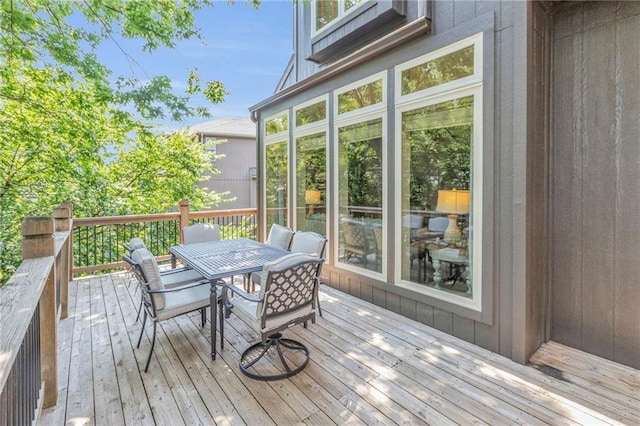 wooden deck with outdoor dining area