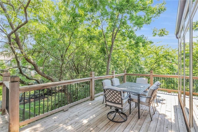 wooden deck with outdoor dining space