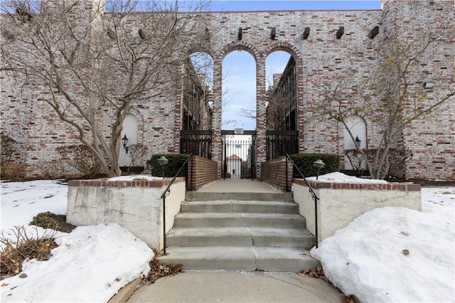 view of snow covered property entrance