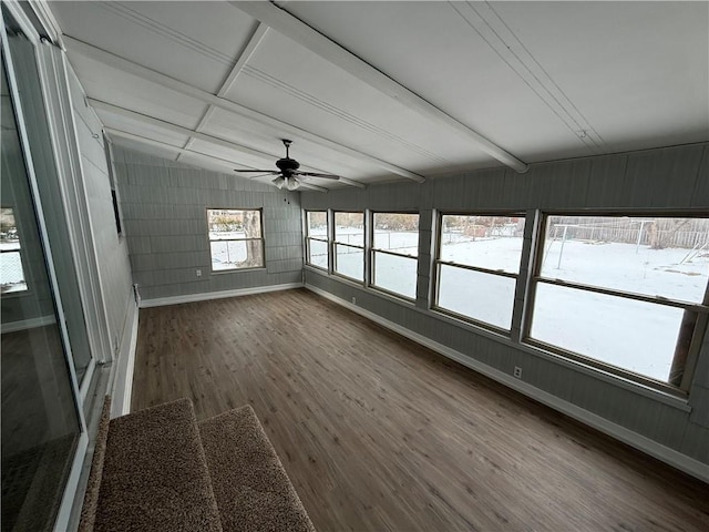 unfurnished sunroom with ceiling fan and vaulted ceiling with beams