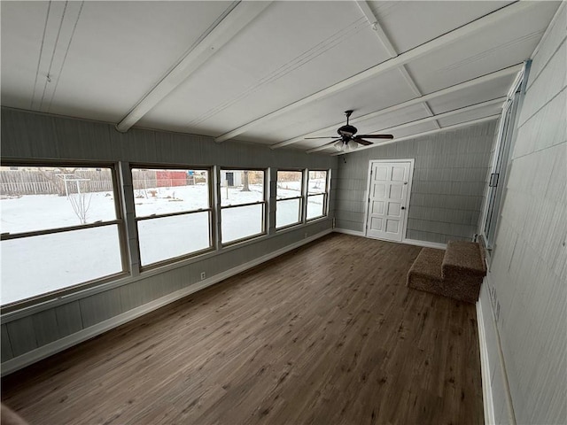 unfurnished sunroom with beam ceiling and ceiling fan