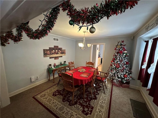 dining area with ornamental molding and an inviting chandelier