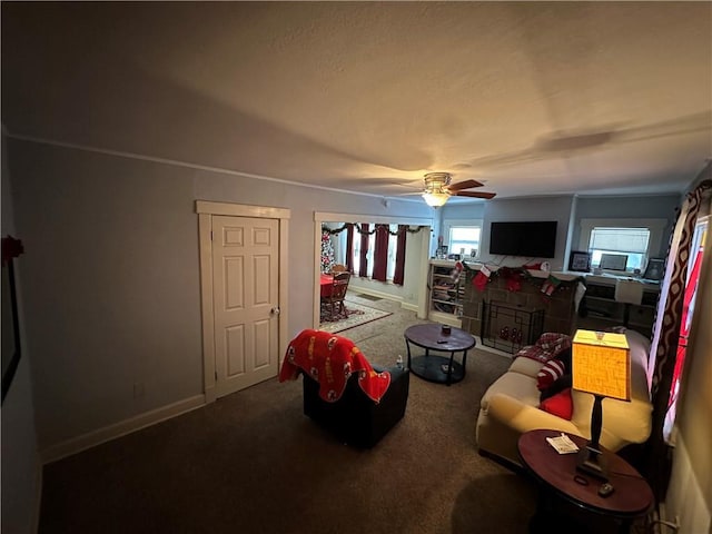 carpeted living room featuring ceiling fan