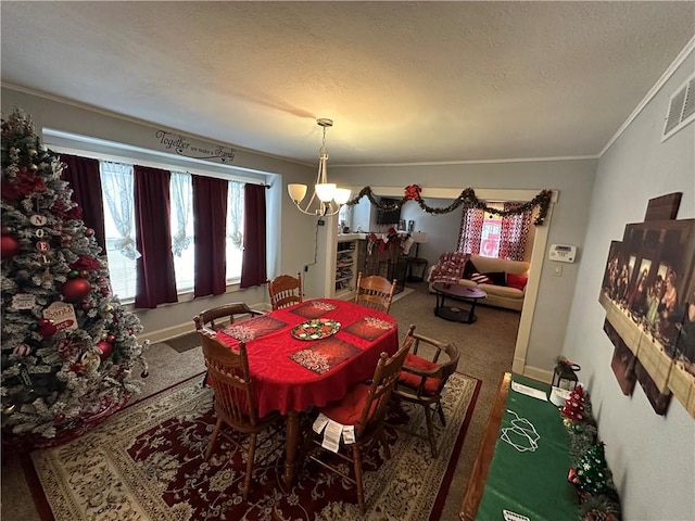 carpeted dining room featuring a textured ceiling, ornamental molding, and a notable chandelier