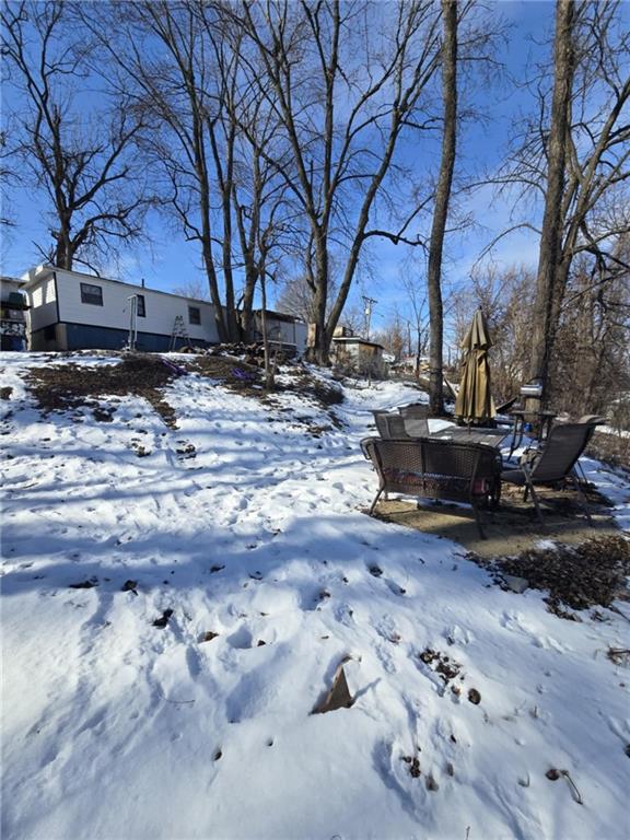 view of yard covered in snow