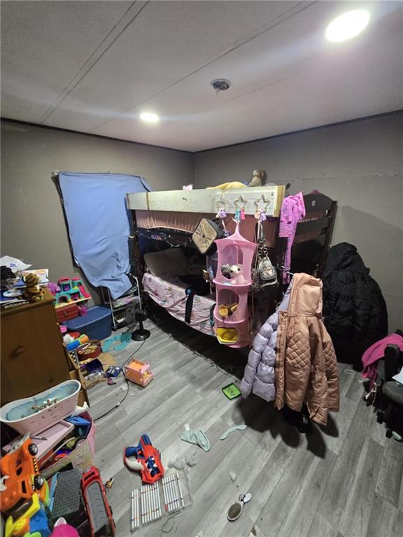 bedroom with wood-type flooring