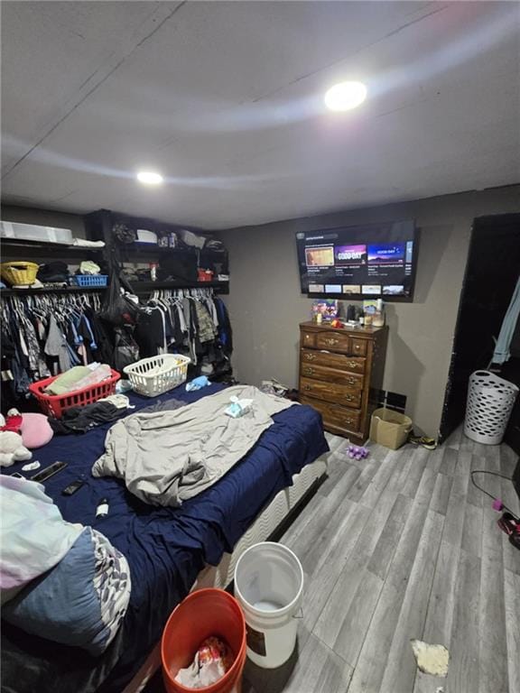 bedroom with wood-type flooring