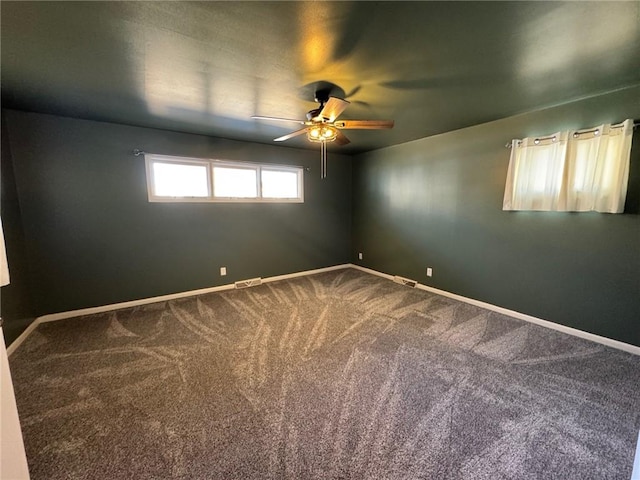 carpeted empty room featuring ceiling fan