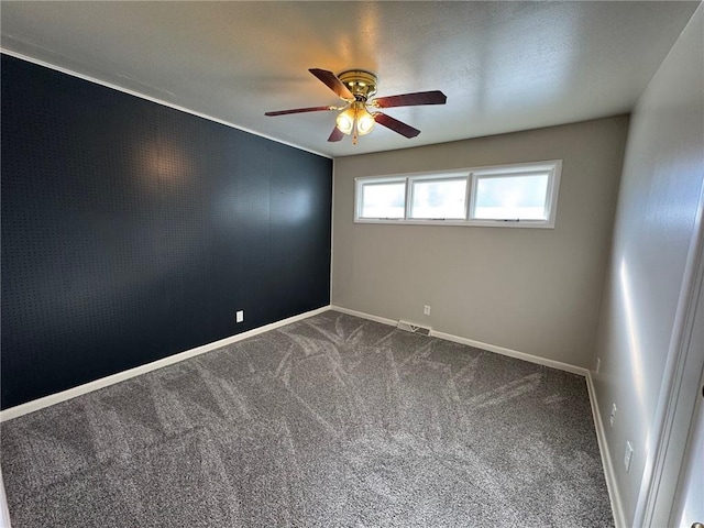 empty room with carpet and ceiling fan