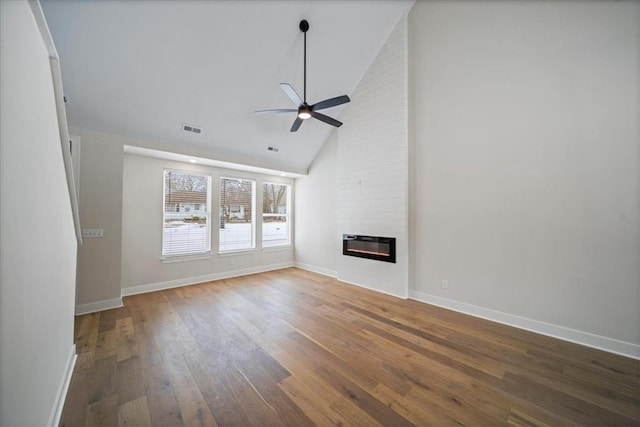 unfurnished living room featuring high vaulted ceiling, ceiling fan, a large fireplace, and hardwood / wood-style floors