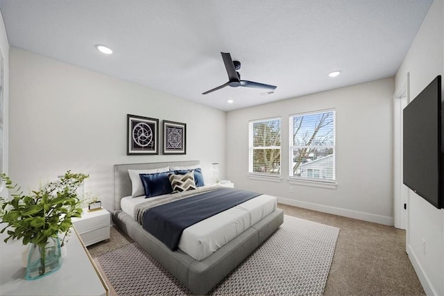 carpeted bedroom featuring ceiling fan