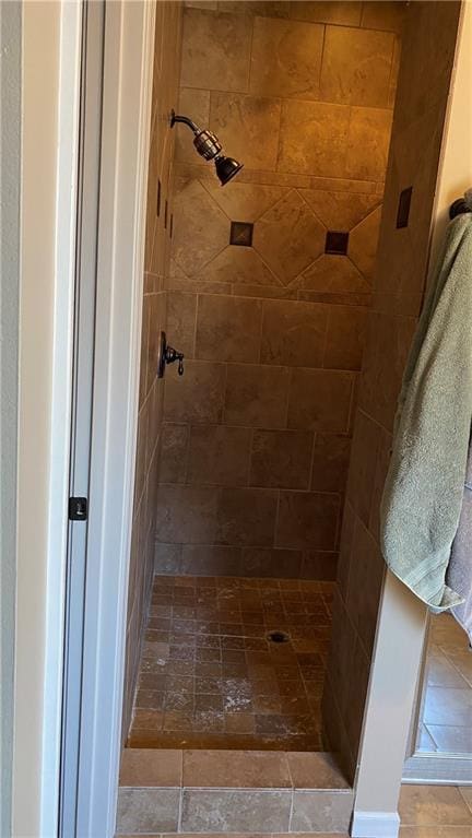 bathroom with a tile shower