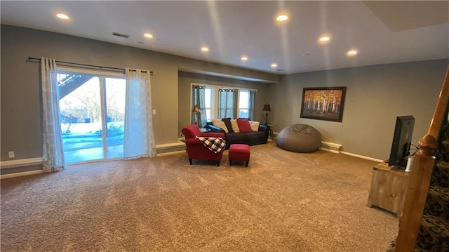 living room with plenty of natural light and carpet flooring