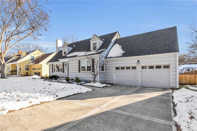 cape cod house with a garage