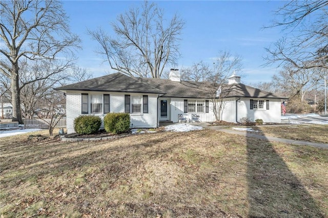 ranch-style house with a front lawn